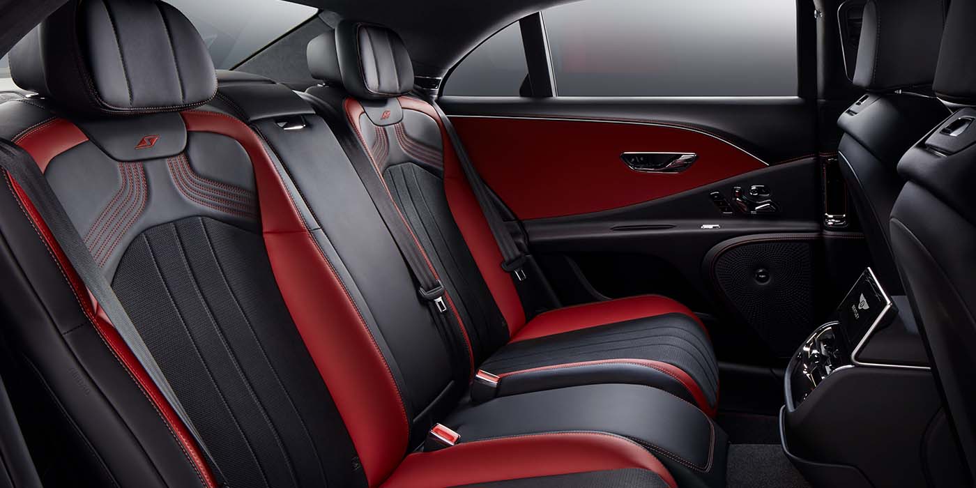 Thomas Exclusive Cars GmbH Bentley Flying Spur S sedan rear interior in Beluga black and Hotspur red hide with S stitching