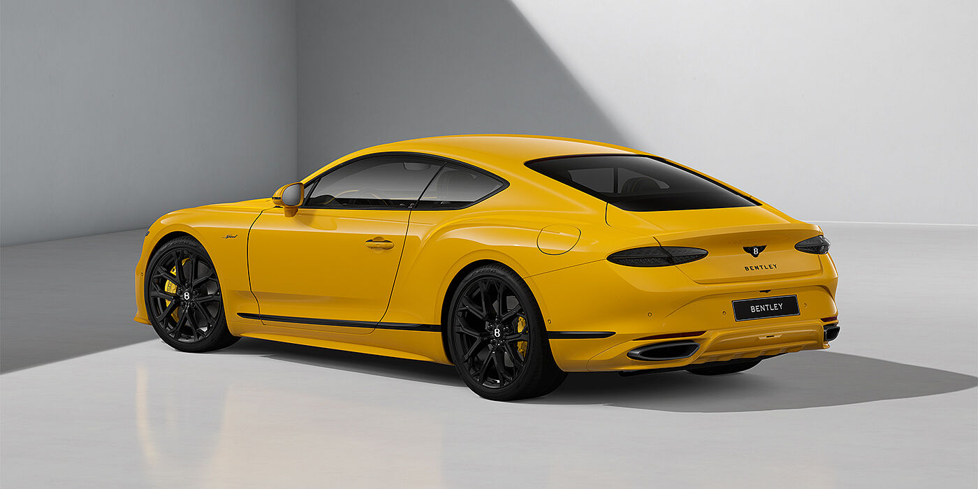 Thomas Exclusive Cars GmbH Bentley Continental GT Speed coupe in Monaco Yellow paint and 22" Ten spoke sport wheels - rear 3/4