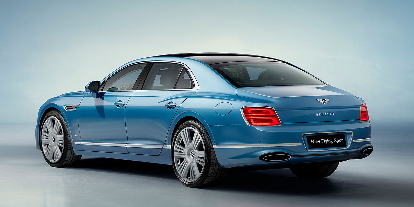 Thomas Exclusive Cars GmbH New Bentley Flying Spur Azure sedan rear view in Light windsor blue by Mulliner paint with 22 inch Azure wheels and chrome exterior details