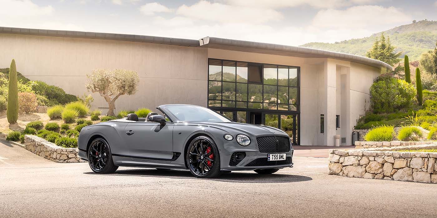 Thomas Exclusive Cars GmbH Bentley Continental GTC S convertible in Cambrian Grey paint front 34 static near house