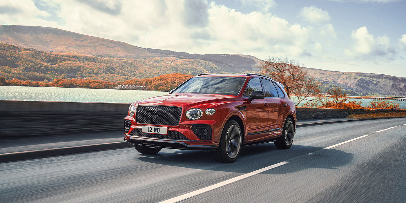 Thomas Exclusive Cars GmbH Bentley Bentayga S SUV in Candy Red paint front 34 dynamic