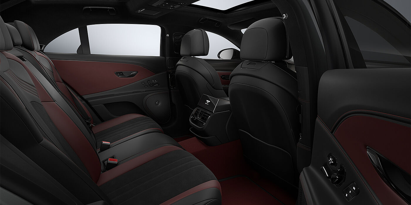 Thomas Exclusive Cars GmbH New Bentley Flying Spur S sedan rear interior in Cricket Ball red  and Beluga black hides with High Gloss Carbon Fibre veneer