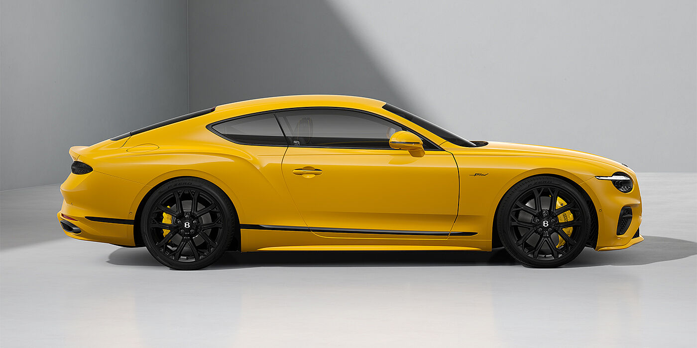 Thomas Exclusive Cars GmbH Bentley Continental GT Speed coupe in Monaco Yellow paint and 22" Ten spoke sport wheels - profile