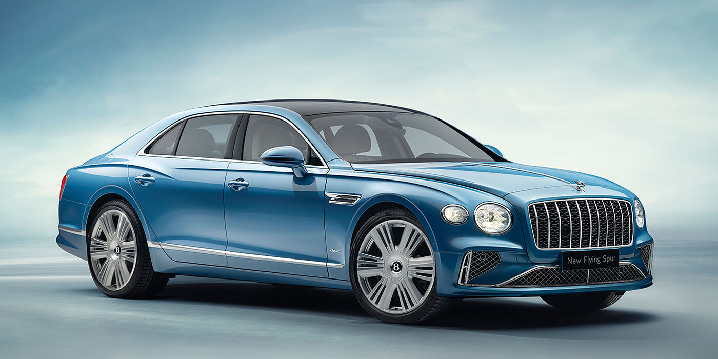 Thomas Exclusive Cars GmbH New Bentley Flying Spur Azure sedan front view in Light windsor blue by Mulliner paint with 22 inch Azure wheels and chrome exterior details