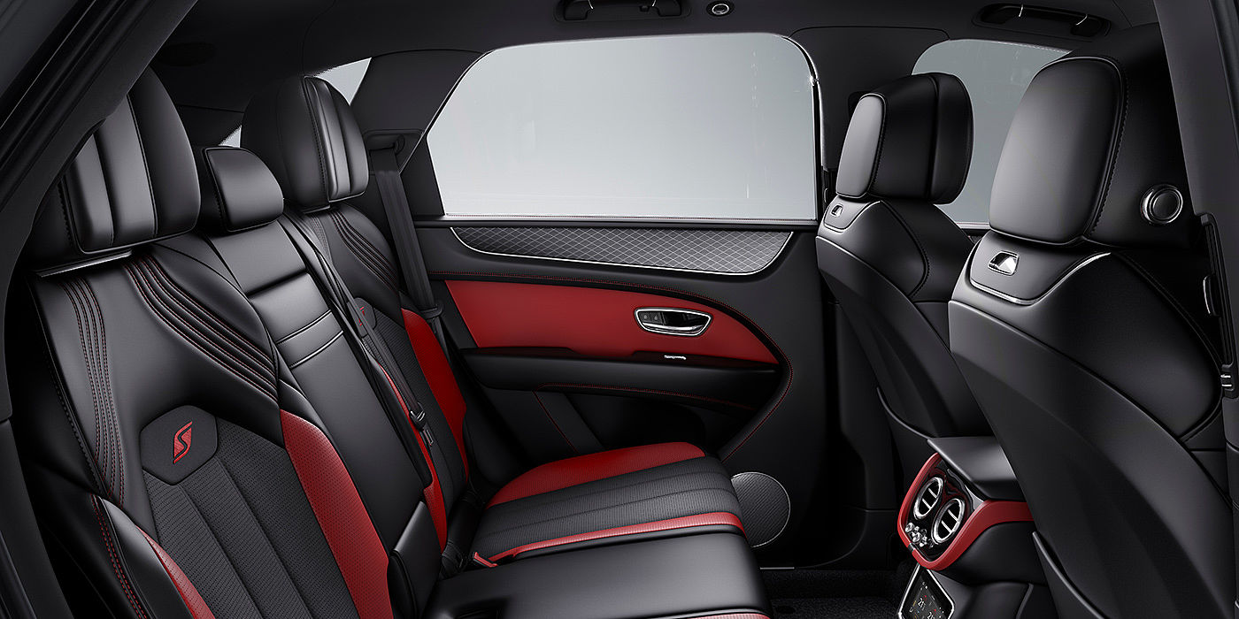Thomas Exclusive Cars GmbH Bentey Bentayga S interior view for rear passengers with Beluga black and Hotspur red coloured hide.