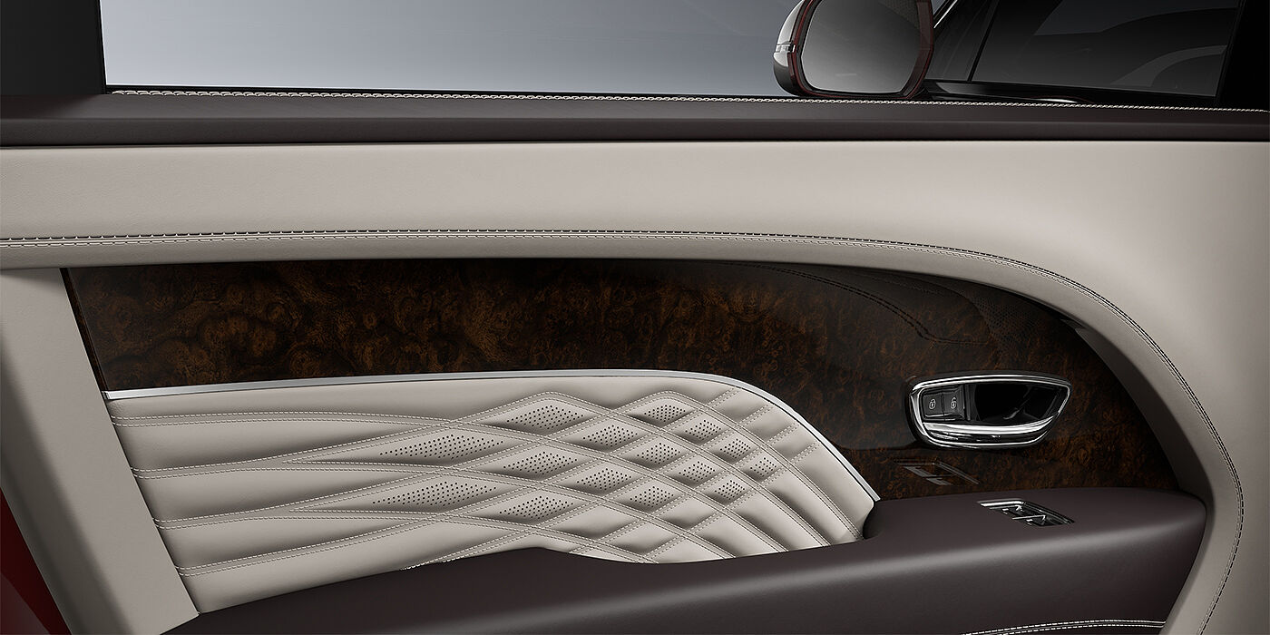 Thomas Exclusive Cars GmbH Bentley Bentayga EWB Azure SUV door interior detail in Linen and Burnt Oak hides with Dark Stained Burr Walnut veneer