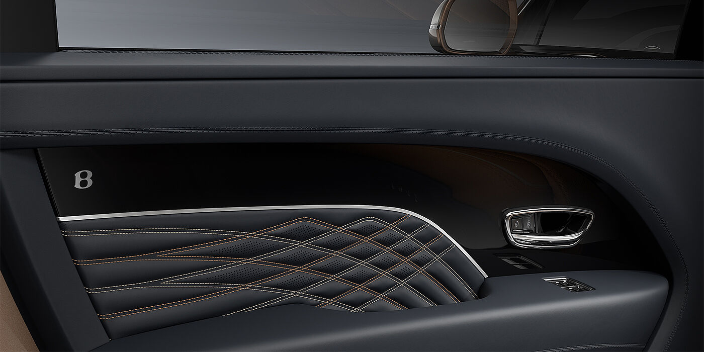 Thomas Exclusive Cars GmbH Bentley Bentayga EWB Mulliner SUV door interior detail in Brunel hide and Grand Black veneer with Mulliner contrast stitching