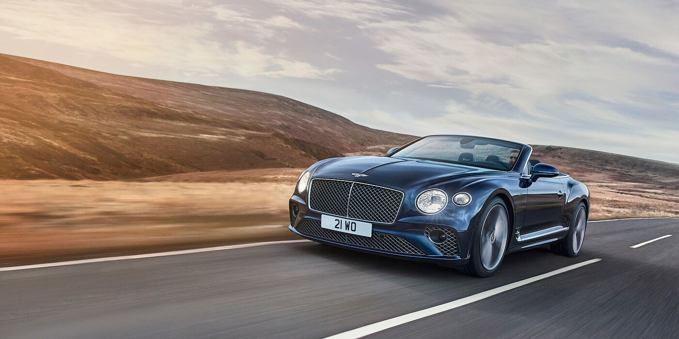 Thomas Exclusive Cars GmbH Bentley Continental GTC Speed convertible in Peacock paint side front 34 dynamic