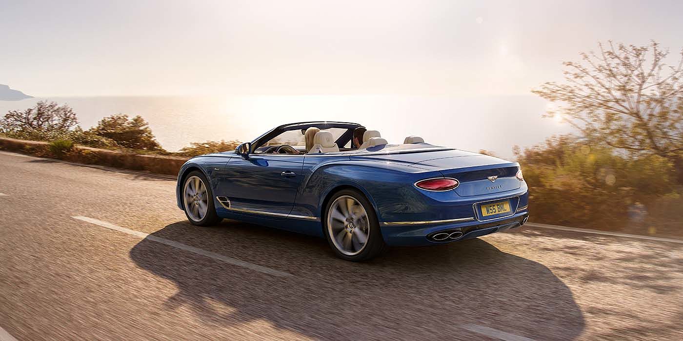 Thomas Exclusive Cars GmbH Bentley Continental GTC Azure convertible in Sequin Blue paint rear 34 dynamic
