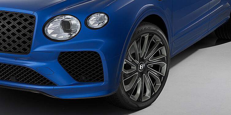 Thomas Exclusive Cars GmbH Bentley Bentayga Artenara Edition SUV front detail in Sequin Blue paint and 22" Mulliner Gloss Black wheels front 3/4