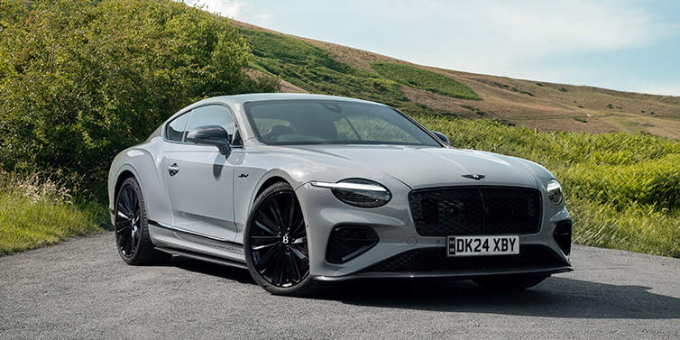 Thomas Exclusive Cars GmbH Bentley Continental GT front three quarter with Carbon Fibre Specification parked on road.
