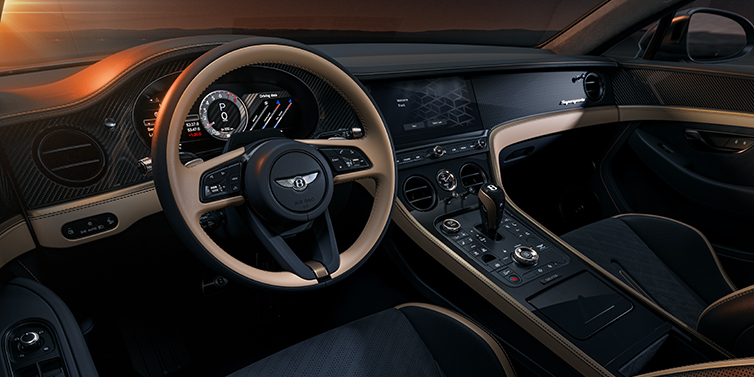 Thomas Exclusive Cars GmbH Bentley Supersports front interior in Beluga and Camel hides with Bronze accents and high gloss black carbon fibre veneer.