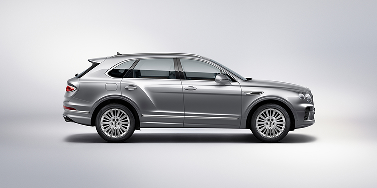 Thomas Exclusive Cars GmbH Bentley Bentayga SUV side profile in Moonbeam silver paint against white background featuring 21 inch 5 spoke wheels