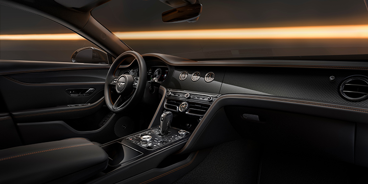Thomas Exclusive Cars GmbH Bentley Flying Spur Black Edition sedan front interior in Beluga black hide with High Gloss Carbon Fibre veneer