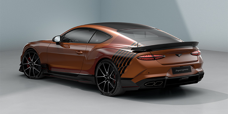 Thomas Exclusive Cars GmbH Bentley Supersports rear three quarter in "Meteorite" Design theme with Orange Flame paint and Beluga Black and Candy Red paint stripes across the rear haunch.