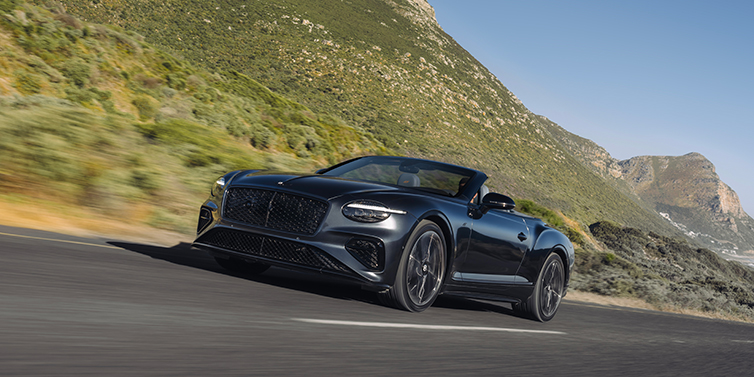 Thomas Exclusive Cars GmbH Bentley Continental GTC S convertible in Thunder paint front 3/4 driving on mountain road
