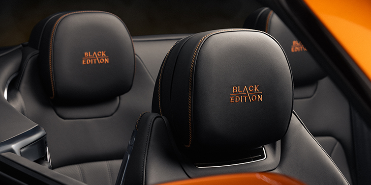 Thomas Exclusive Cars GmbH Bentley Continental GTC Black Edition convertible seat detail with Beluga black hide and Mandarin emblem stitching