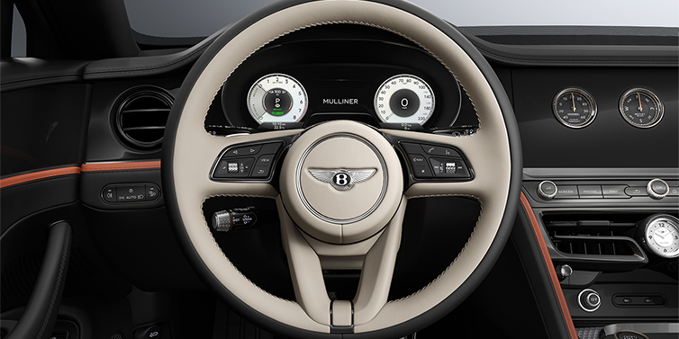 Thomas Exclusive Cars GmbH New Bentley Flying Spur Mulliner sedan steering wheel and dash in Portland and Beluga Black hides and Grand Black veneer