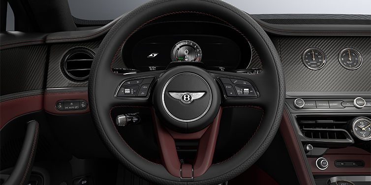 Thomas Exclusive Cars GmbH New Bentley Flying Spur S sedan steering wheel and dash in Cricket Ball red and Beluga black hides and High Gloss Carbon Fibre veneer